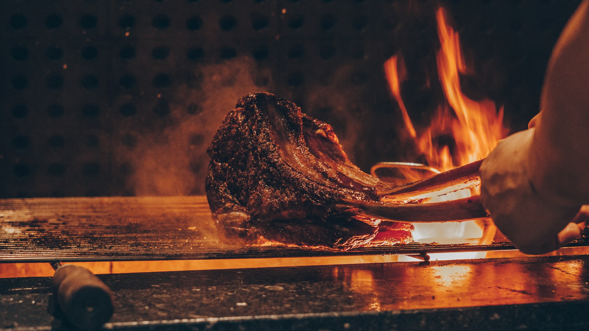 A thick steak flame-grilled over open fire